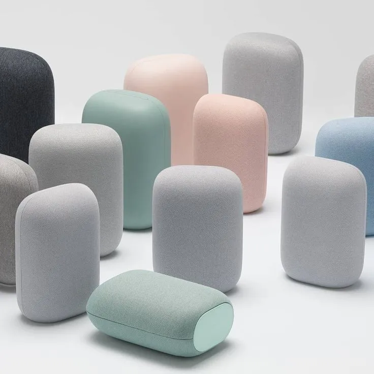several different colored pillows sitting next to each other