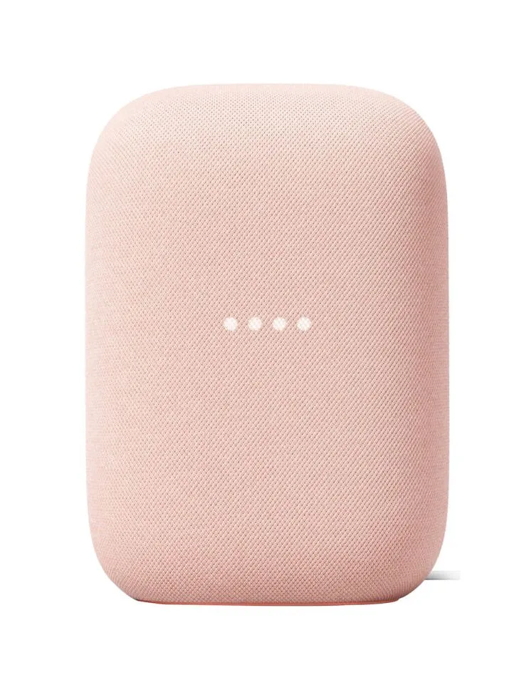 the google home mini is shown in pink