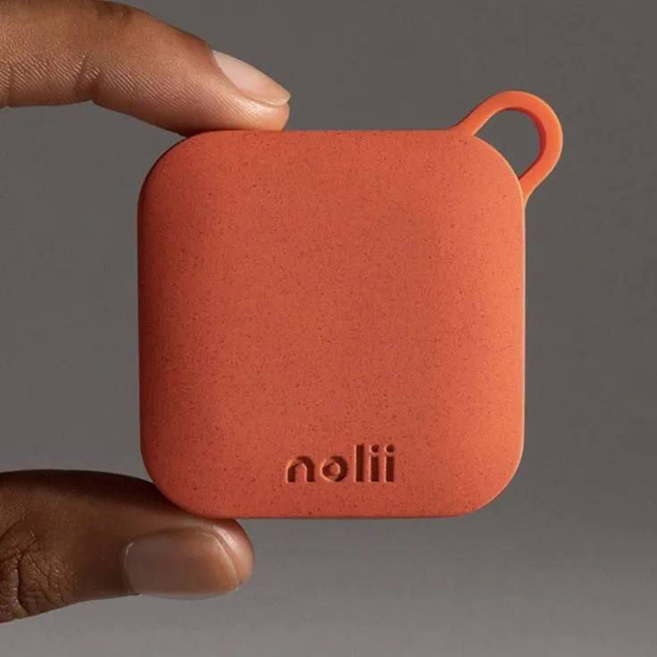 a hand holding an orange case with the word lilon on it