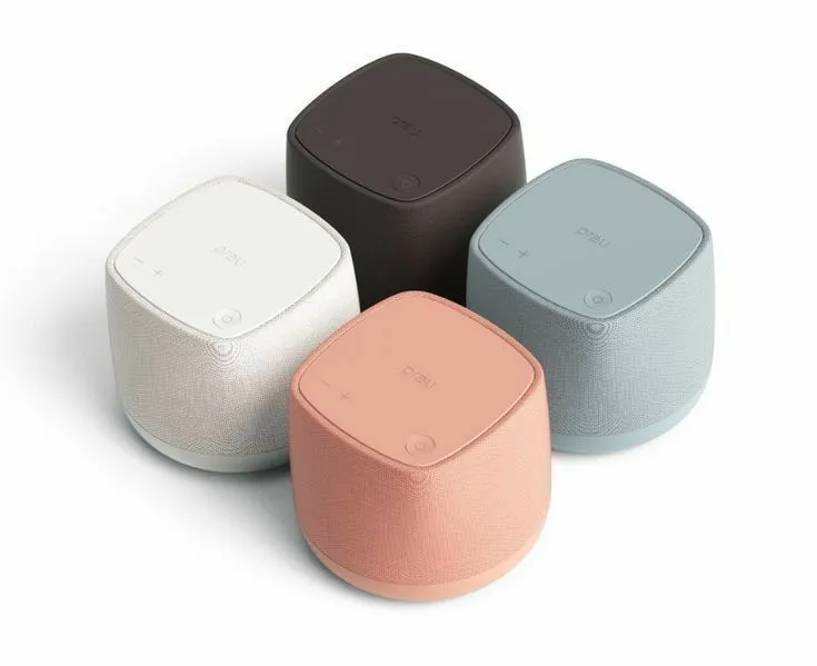 three different colored speakers sitting next to each other
