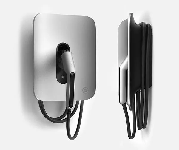 an electric car charger attached to the back of a white wall