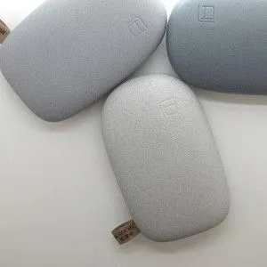 three electronic devices sitting next to each other on top o