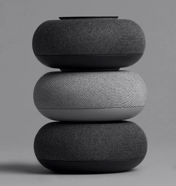 the google home mini is stacked on top of each other in fron